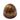 Handgemachte Praline mit Karamell, Nougat und einer Haselnuss