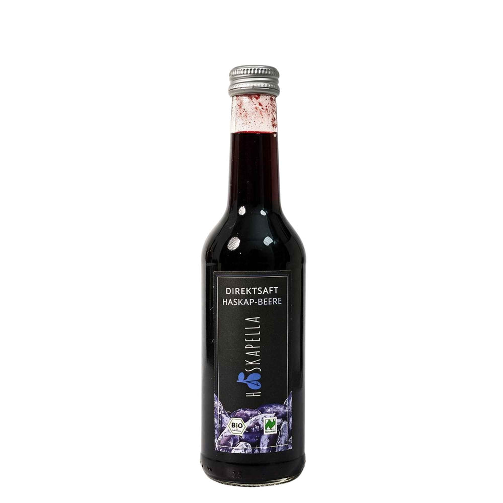 Flasche mit Haskap-Direktsaft aus Bio-Beeren, naturtrüb und tiefrot