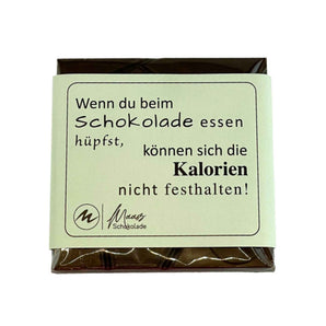 Tafel Madagaskar 64% Zartbitter Schokolade mit Spruch auf der Verpackung